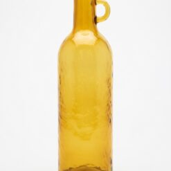 Vaso bottiglia ambra in vetro 75 cm J‑Line: design elegante, colore caldo e forma scenografica. Perfetto per rami decorativi e ambienti moderni.